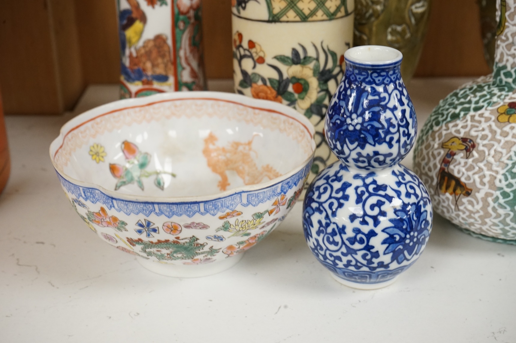 Chinese and Japanese items to include an early 20th century Chinese eggshell porcelain bowl and an enamelled bronze vase, largest 19cm high